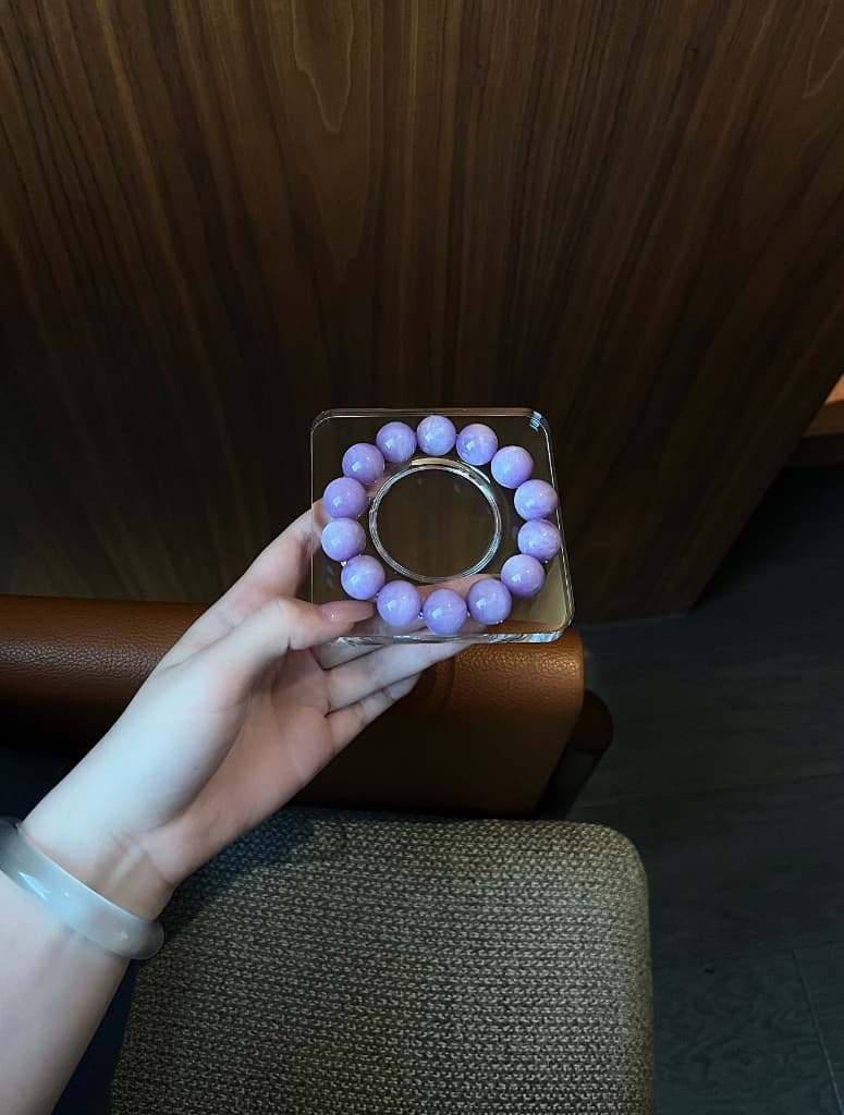 Lavender chalcedony bracelet on a glass stand